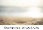 Blurr sand texture on sea background with sun flare