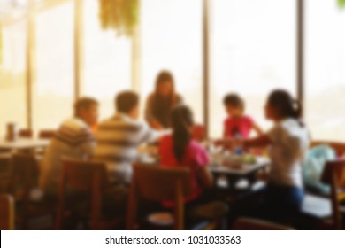 Blurred abstract background Big family meeting and breakfast in the restaurant