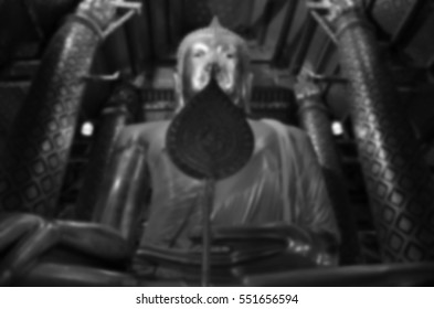 Blurred abstract background of Buddha statue