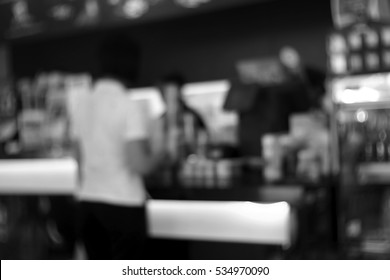 Blurred abstract background and can be illustration to article of woman paying in a shop