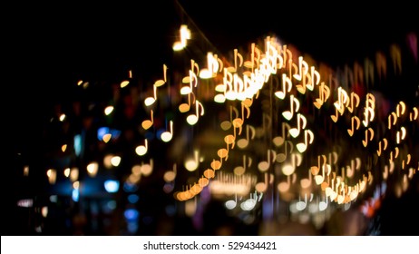 Blurred Abstract Background Christmas Light With Music Note Bokeh