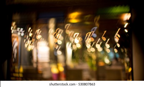 Blurred Abstract Background Christmas Light With Music Note Bokeh