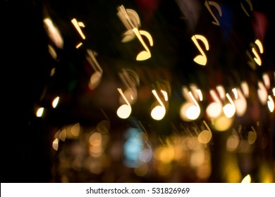 Blurred Abstract Background Christmas Light With Music Note Bokeh