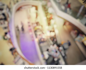 blurred abstract background image of crowd of people in motion in escalators at the modern shopping mall go to shopping in rush hour. Business, Shopping, transportation, supermarket, consumers concept