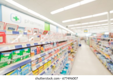 Blurred Abstract Background Inside Pharmacy Store With Arranged Variation Of Pharmaceutical And Medical Supplies Product In Label On Shelves Display. Indoor Space Of Drug Chain In US, Medicines Aisle.