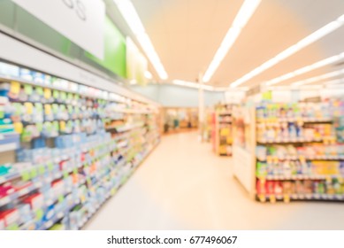 Blurred Abstract Background Inside Pharmacy Store With Arranged Variation Of Pharmaceutical And Medical Supplies Product In Label On Shelves Display. Indoor Space Of Drug Chain In US, Medicines Aisle.