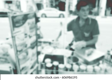 Blurred abstract background of A man selling ice cream on a cart.