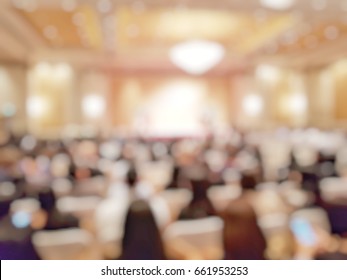 Blurred Abstract Background Of People In Meeting Room . Blur View Of Attendance In Conference Hall With Projectors.Defocus Seminar At Business And Entrepreneurship Meeting With Audience.