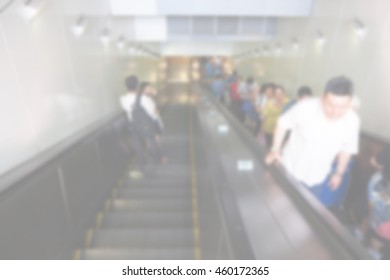 Blurred abstract background of People using escalator