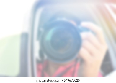 Blurred abstract background of Persons using the hand camera
