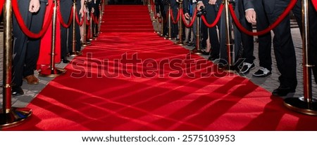 Blurred abstract background with red carpet and celebrities