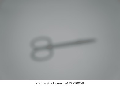 blurred abstract background small iron scissors - Powered by Shutterstock