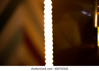 Blurred abstract background with spots of light. Defocused  bokeh.