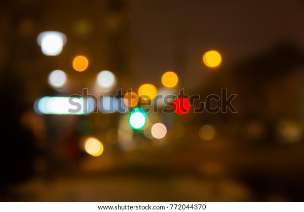 Blurred abstract
background. The street lights in a blur. Evening or night city.
Light of shop Windows and
cars.
