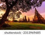 Blurred abstract background of sunset with ancient ruins, large pagodas to learn the history of (Wat Chaiwatthanaram) in Ayutthaya province of Thailand.
