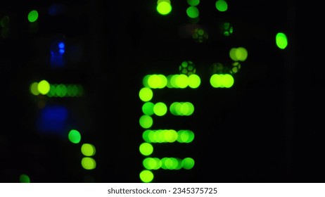 Blurred abstract bokeh background of computer lights. The defocused light from the LEDs gave the appearance of artificial intelligence blinking in the background of the digital network. - Powered by Shutterstock