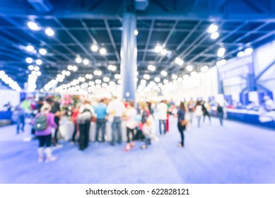 Blurred Abstract Crowd Of People In Conventional Hall/expo Event Fair To Pickup Running T-shirt 5K, 10K, Half, Full Marathon Race In Houston, Texas, US. Fitness, Healthy Lifestyle Concept Background.