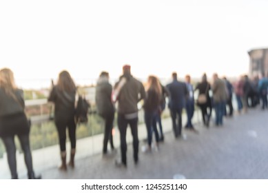 Blurred Abstract Diverse Group Of People In Formal Dress Hanging Out At Rooftop Bar In Downtown Chicago, USA. Business Happy Hour Concept, Autumn Season