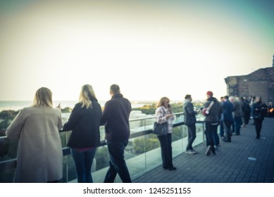 Blurred Abstract Diverse Group Of People In Formal Dress Hanging Out At Rooftop Bar In Downtown Chicago, USA. Business Happy Hour Concept, Autumn Season