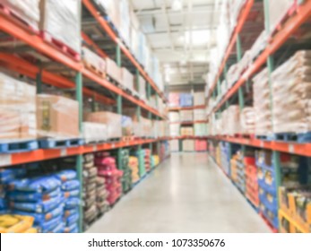 Blurred Abstract Dog And Cat Food Shelves In Modern Distribution Warehouse Or Storehouse. Defocused Pet Food Aisle Wholesale From Floor To Ceiling.