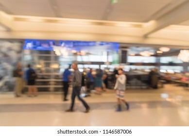 Blurred abstract exterior of airport sport bar in Dallas Fort-Worth, Texas, USA. Blurry background with bokeh light people waiting at the airport