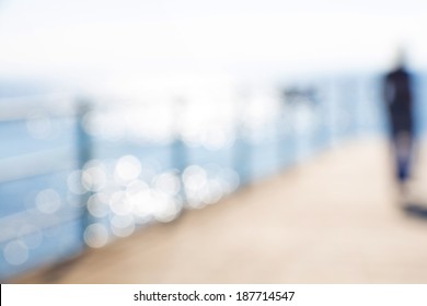 Blurred Abstract Female Figure With Sea Background And Bokeh