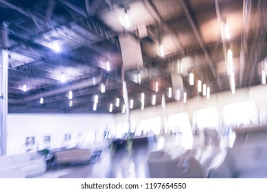 Blurred Abstract Low Angle View To Ceiling At Asian Furniture And Appliances Showroom Mega Retail Store In Texas, USA. Rows Of High-end Sofa And Living Room Supplies