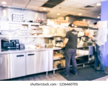 Blurred abstract preparing, cooking ordered dishes from kitchen of breakfast restaurant in Chicago, USA