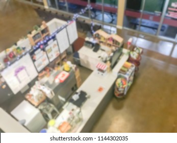 Blurred Abstract Top Down View Compact Juice Bar And Café In US Shopping Mall. Blurry Food Kiosk Booth Counter.