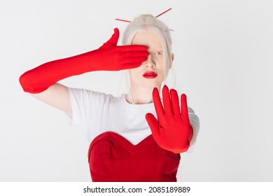 Blurred Albino Model In Red Gloves Showing Stop Sign Isolated On White