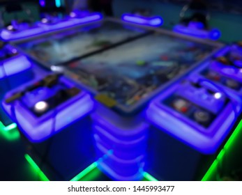 blurred arcade machine game for children game play  in department store. Playground with colorful neon lights and bokeh light. Colorful absract background. - Shutterstock ID 1445993477