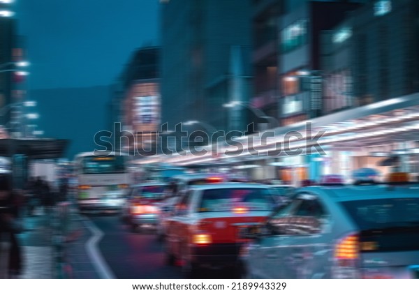 Blurred Asian City\
Scape with cars in\
traffic