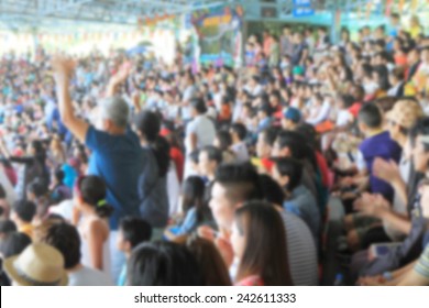 A Blurred Asian Crowd In A Stadium