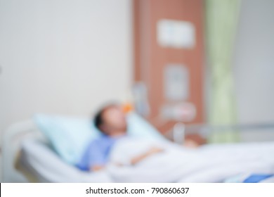 Blurred Asian Patient Man Sleeping On Bed In Icu Room Waiting For Doctor To Healing Or Treatment,unhealthy Life And Insurance Claim Concept