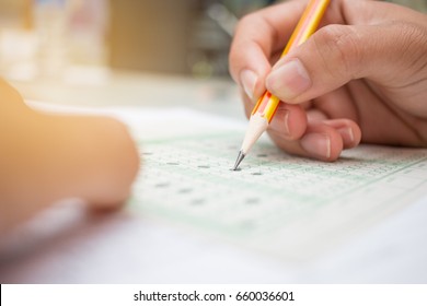 Blurred Of Asian, Thai Student Testing In Exercise, Or Taking Exams Answer Sheets In School Class Room