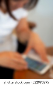 Blurred  background abstract and can be illustration to article of businesswoman use mobile phone