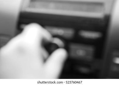 Blurred  Background Abstract And Can Be Illustration To Article Of Hand Adjusting The Sound Volume In The Car Stereo