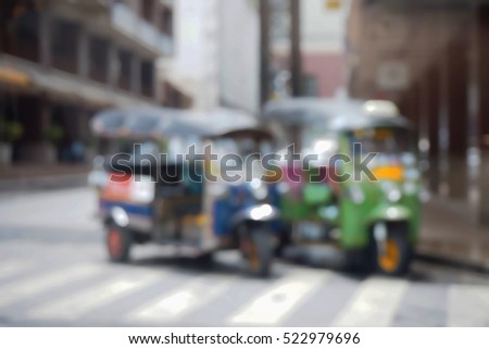 Blurred  background abstract and can be illustration to article of threewheeler classic motorised tuk-tuk taxi in Bangkok, Thailand