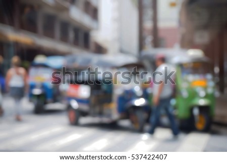 Blurred  background abstract and can be illustration to article of threewheeler classic motorised tuk-tuk taxi in Bangkok, Thailand