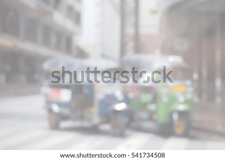 Blurred  background abstract and can be illustration to article of threewheeler classic motorised tuk-tuk taxi in Bangkok, Thailand