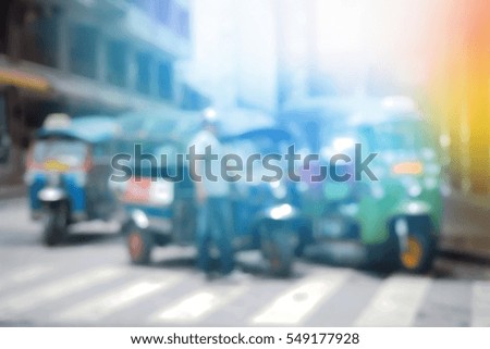 Blurred  background abstract and can be illustration to article of threewheeler classic motorised tuk-tuk taxi in Bangkok, Thailand