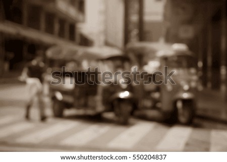 Blurred  background abstract and can be illustration to article of threewheeler classic motorised tuk-tuk taxi in Bangkok, Thailand