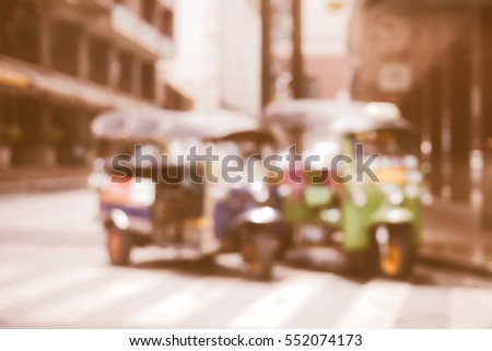 Blurred  background abstract and can be illustration to article of threewheeler classic motorised tuk-tuk taxi in Bangkok, Thailand