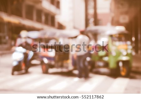 Blurred  background abstract and can be illustration to article of threewheeler classic motorised tuk-tuk taxi in Bangkok, Thailand