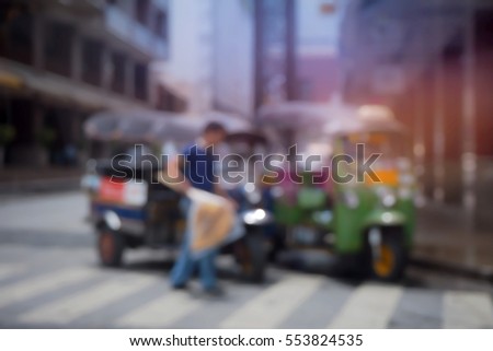 Blurred  background abstract and can be illustration to article of threewheeler classic motorised tuk-tuk taxi in Bangkok, Thailand
