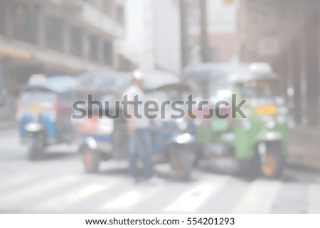 Blurred  background abstract and can be illustration to article of threewheeler classic motorised tuk-tuk taxi in Bangkok, Thailand