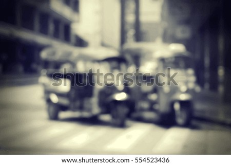 Blurred  background abstract and can be illustration to article of threewheeler classic motorised tuk-tuk taxi in Bangkok, Thailand