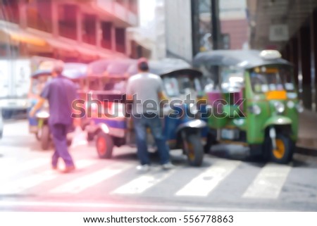 Blurred  background abstract and can be illustration to article of threewheeler classic motorised tuk-tuk taxi in Bangkok, Thailand
