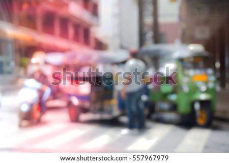 Blurred  background abstract and can be illustration to article of threewheeler classic motorised tuk-tuk taxi in Bangkok, Thailand