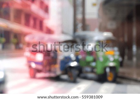 Blurred  background abstract and can be illustration to article of threewheeler classic motorised tuk-tuk taxi in Bangkok, Thailand